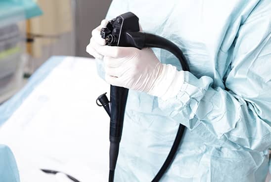 Physician holding a colonoscopy probe
