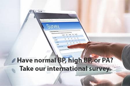 Outstretched hand of person selecting survey responses on a touch screen
