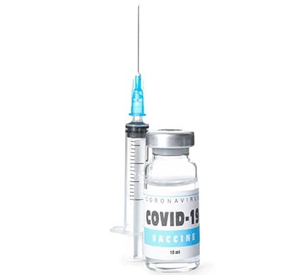 Syringe and vial of COVID-19 vaccine