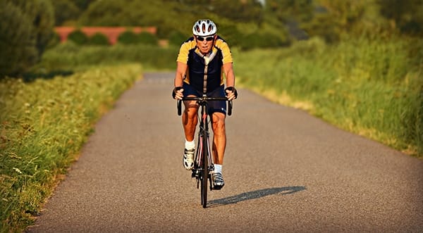 Cyclist riding on a road in the countryside